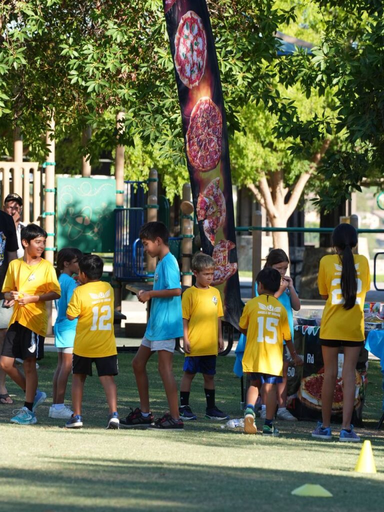 Camp participants taking a snack break during the tournament