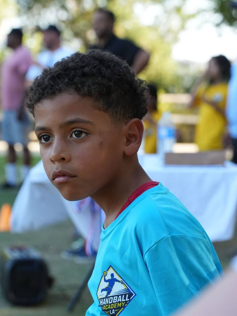 A camp participant wearing a Handball Academy LA shirt